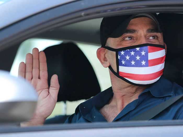 Amid the COVID-19 pandemic, US Citizenship and Immigration Services had to host drive-in naturalization ceremonies to help stop the spread of the virus.