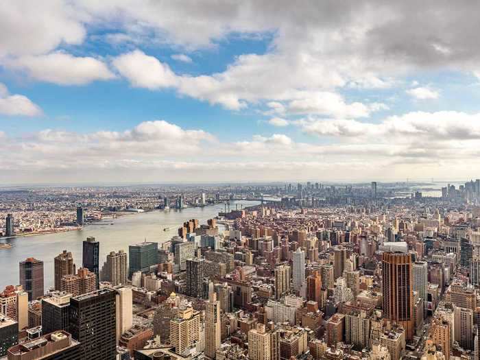 To the southeast, the East River and Brooklyn can be seen.