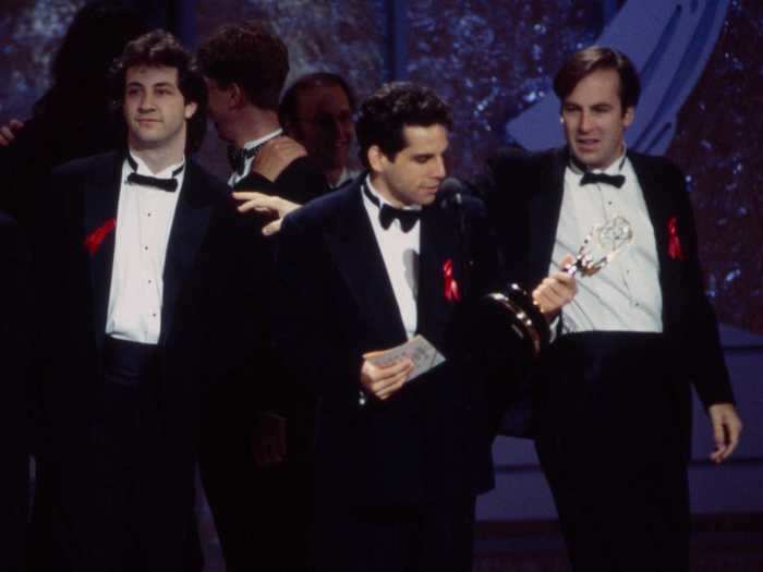 Bob Odenkirk wore matching tuxedos and red ribbons with Judd Apatow and Ben Stiller at his first Emmys in 1993, where they won for their writing on "The Ben Stiller Show." The red ribbon is the universal symbol for HIV and AIDS awareness.