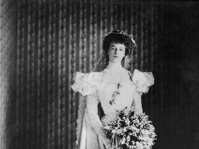 Eleanor Roosevelt wore a long-sleeved satin gown covered in Brussels lace and accented with tulle.