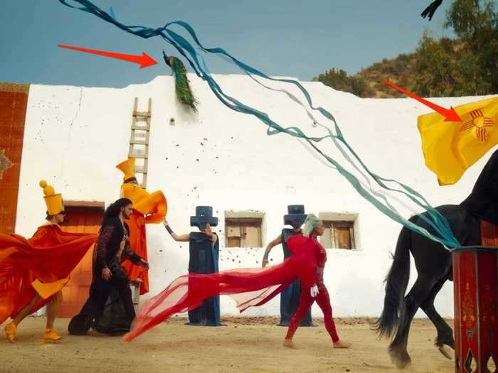 This parade-like scene appears to symbolize death and resurrection.