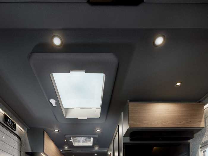 The tiny home on wheels can be brightened with its ambient indirect, reading, and in-ceiling lights.