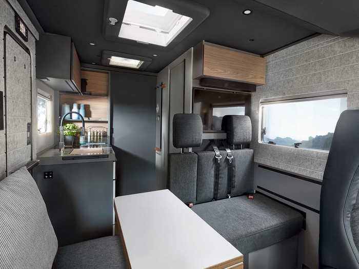 Towards the front half of the motorhome is the leisure area, which includes seating options and table for dining, lounging, or work if you’re a digital nomad.