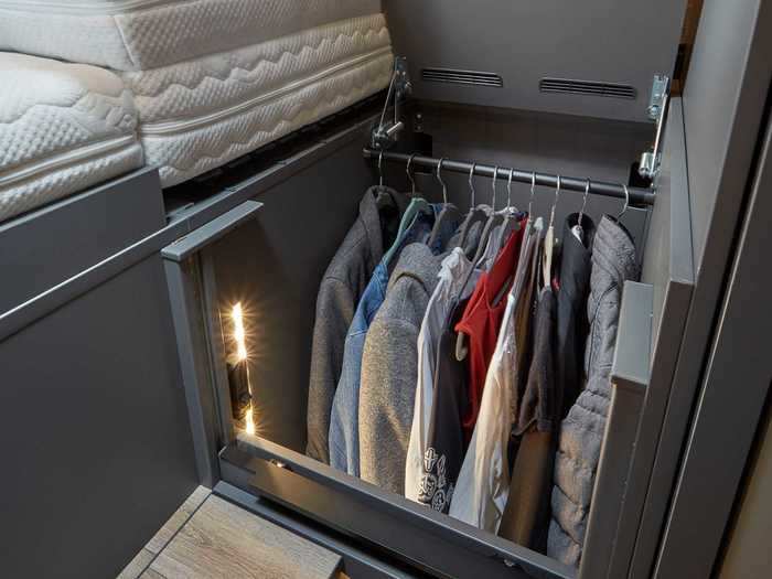 There are wardrobes under the bed for a hidden storage spot.