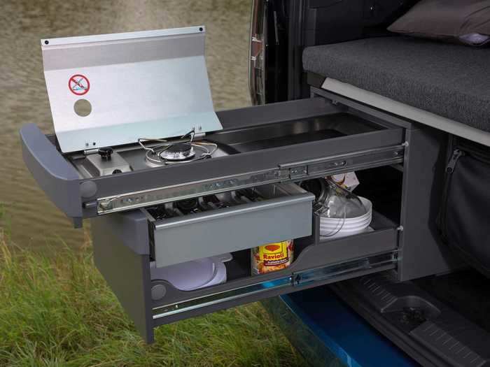 For meals on the road or at a campsite, the Caddy California comes equipped with an optional two-part kitchen that extends out the back of the vehicle.