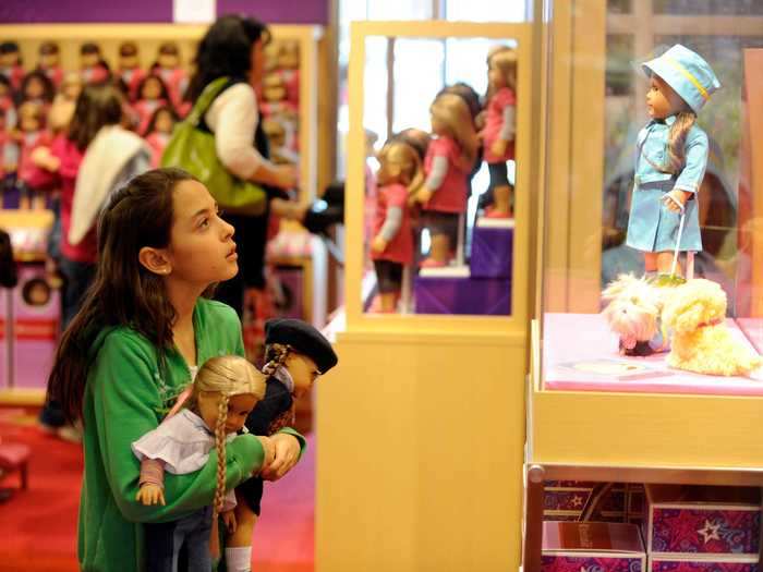 ... while they browse the store, looking for a new outfit to add to their American Girl collection.