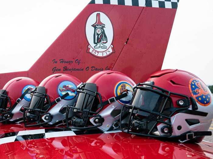 The helmets have the four patches of the 99th, 100th, 301st, and 302nd squadrons occupied by the Tuskegee Airmen.