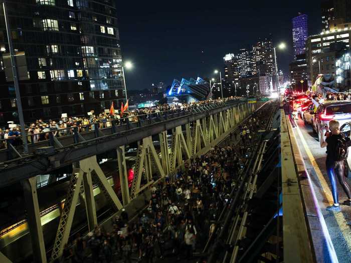 Thousands took part in multiple protests in New York City, with the largest group at one point marching over the Manhattan bridge and bringing traffic to a standstill.