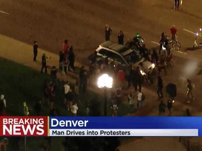 A driver was detained in Denver after accelerating through a group of Breonna Taylor protesters and hitting one demonstrator.