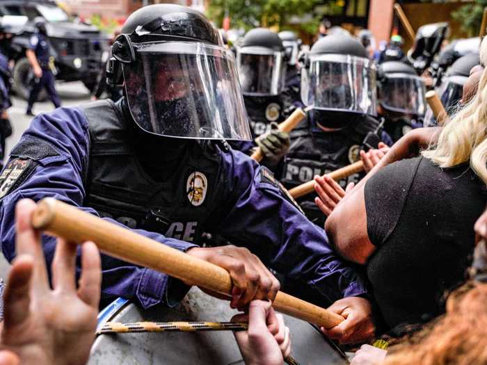 Police and protesters clashed. Police say around 100 protesters were arrested.