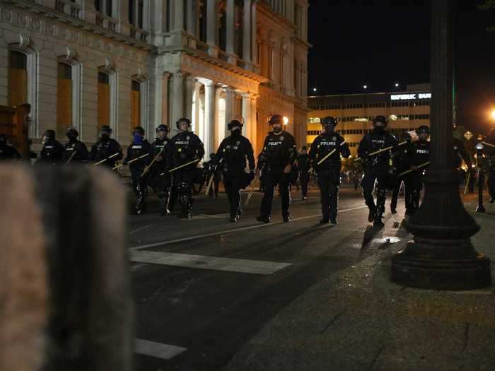 In Louisville, police marched through the city.