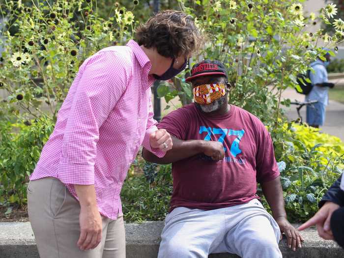 Democratic Senate candidate Amy McGrath greeted Louisville resident Michael Dorsey in Jefferson Square Park.