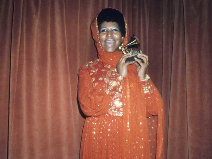 At the 1972 Grammys, Aretha Franklin looked spectacular in a head-to-toe orange ensemble.