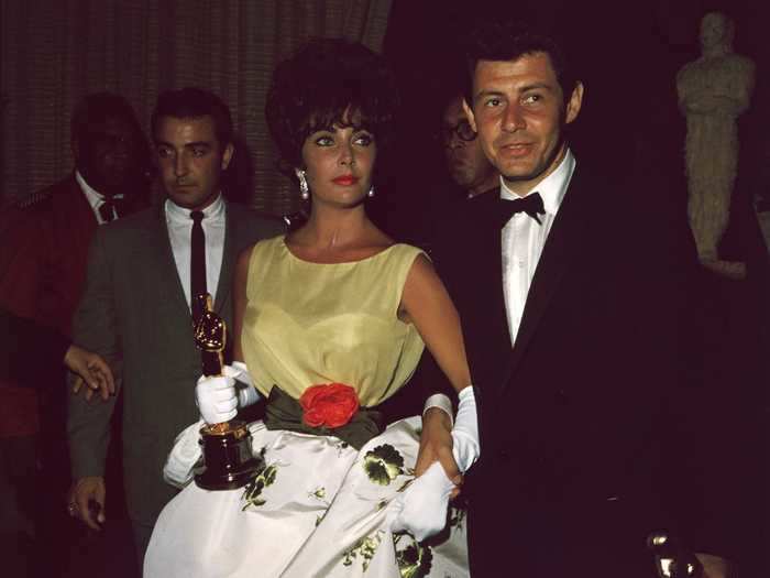 Elizabeth Taylor wore a gown with floral details to the 1961 Academy Awards.