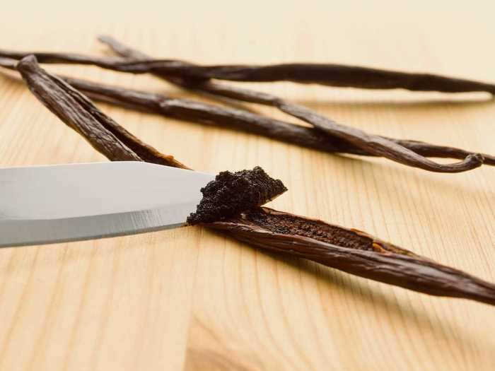 Vanilla bean pods are dried until brown, and the sliced open and scraped to reveal the vanilla "paste" inside (which is really just a ton of little seeds).