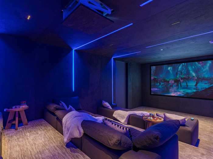 The media room has the potential to create an authentic theatre-going experience for the family — it comes with a massive 145-inch projection screen and speakers.