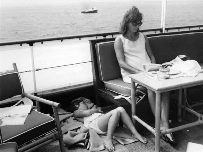 Jackie Kennedy Onassis, then the first lady of the US, on the presidential motor yacht Honey Fitz in 1963 with her daughter, Caroline.