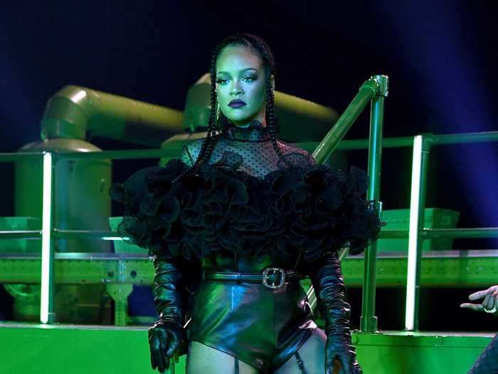 Once inside, Rihanna changed into a custom Alexandre Vauthier ruffle swiss-dot blouse and black leather shorts.