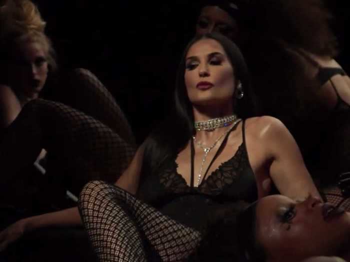Demi Moore wore a black teddy and fishnet stockings during the show.