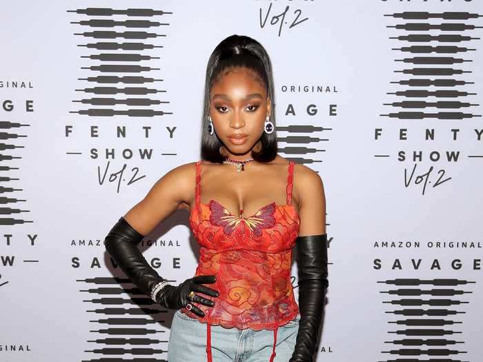 Normani also opted for a laid-back look, pairing a red top with jeans and leather gloves.
