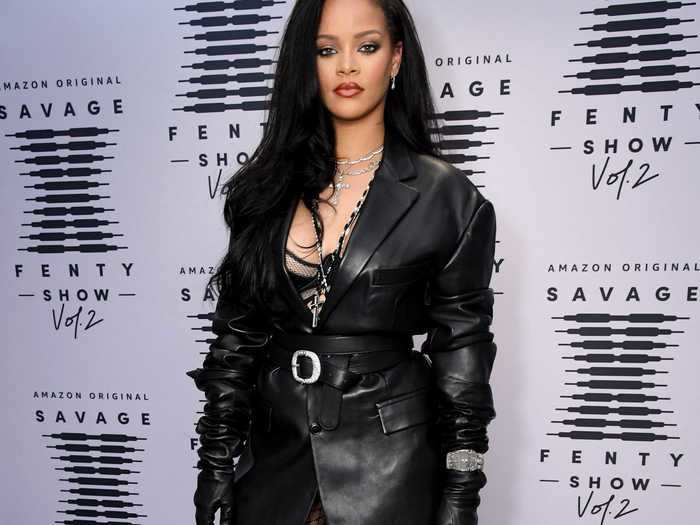 Rihanna looked ready for business in a leather blazer with matching gloves, fishnet pantyhose, and her Savage X Fenty lingerie peeking through.