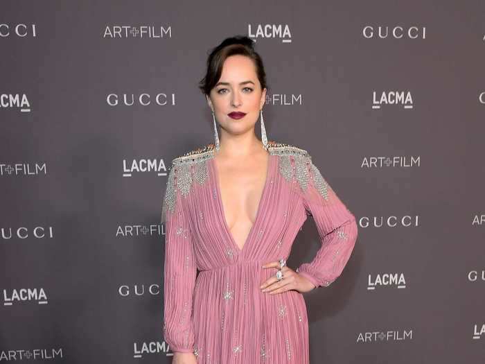 At the 2017 LACMA Art + Film Gala, she wore a pink and silver gown with a berry lip shade and long silver earrings.