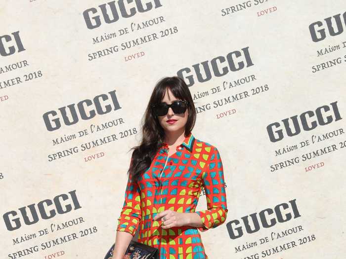 At Milan Fashion Week, Johnson channeled her inner fashionista with a bright dress, big sunglasses, and funky clutch.