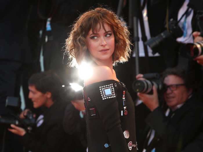 At the 72nd Venice Film Festival in September 2015, Johnson looked nearly unrecognizable with curled, short brown hair, and a funky black dress.