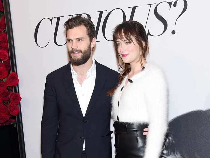 At a fan screening for "Fifty Shades of Grey," she joined costar Jamie Dornan, wearing a high-waisted leather skirt and fuzzy white top.