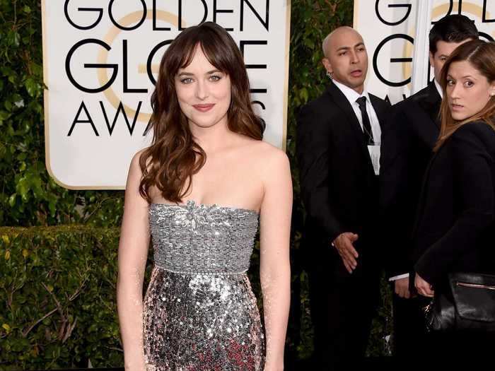 At the 72nd Annual Golden Globes, Johnson wore a disco ball-esque silver gown, with matching silver shoes and a shiny clutch.