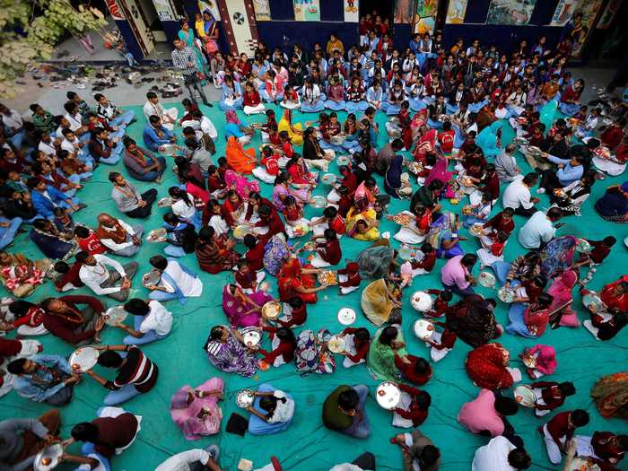 In India, students observe traditional rituals.