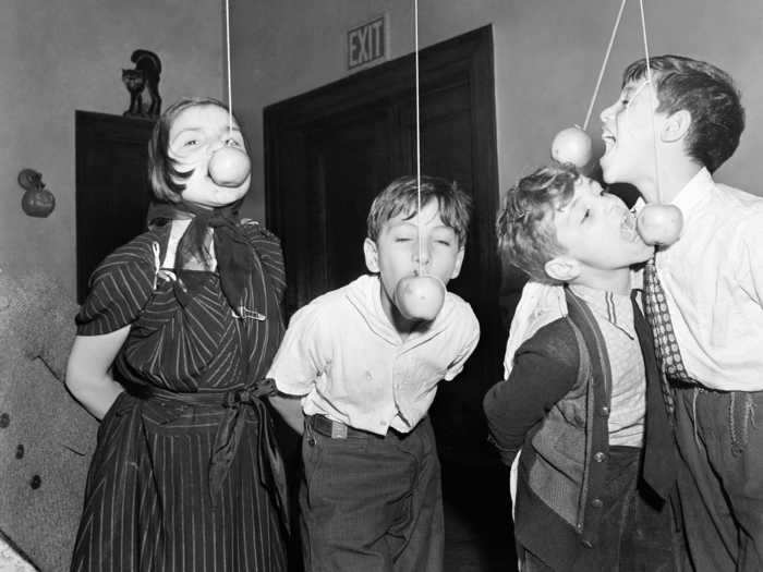 Bobbing for apples on a string was a popular Halloween party game in the 1930s.