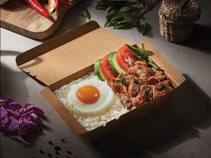 Beloved dishes from the in-flight menu include Thai basil chicken with rice ...