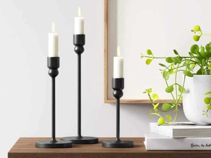 These candle holders can set the mood for a Zoom get-together with their sleek and simple design.