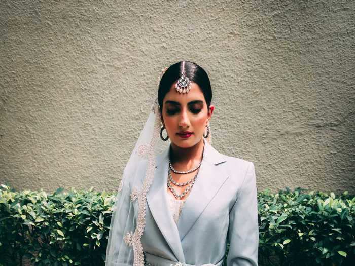 But when their plans changed, Rishi decided to wear a suit to her Indian wedding ceremony.