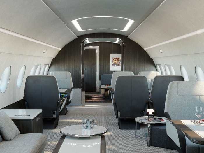 A six-seat conference and dining space then comprise the next living area as one moves further into the plane.