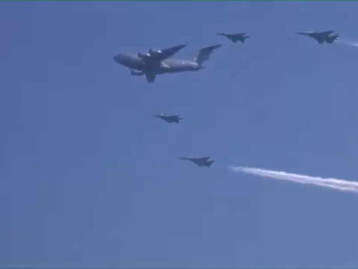 In a group formation, the C-17 aircraft was seen leading with MiG-29 and two Su-30 KI on its flank as it soared above the air base.