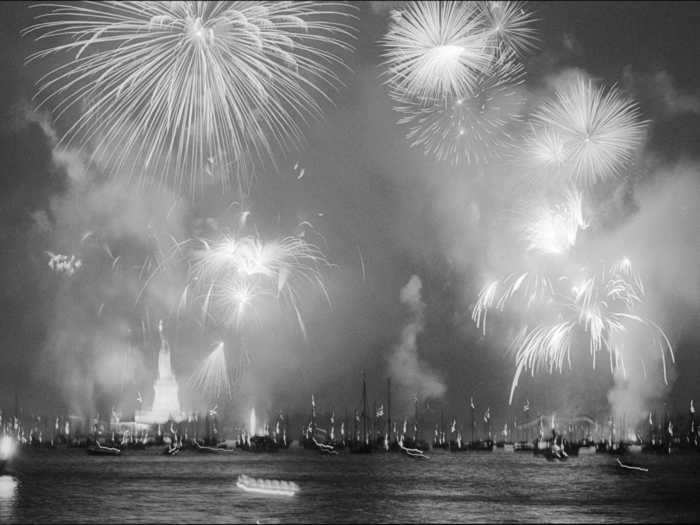 Fireworks filled the night sky over New York Harbor and the Statue of Liberty during America