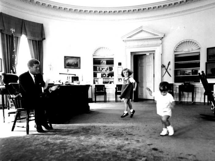 President John F. Kennedy watched his children John J. and Caroline in the Oval Office in 1962.