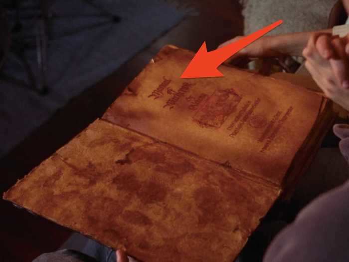 During one scene, viewers can see the title of the spellbook the witches use.