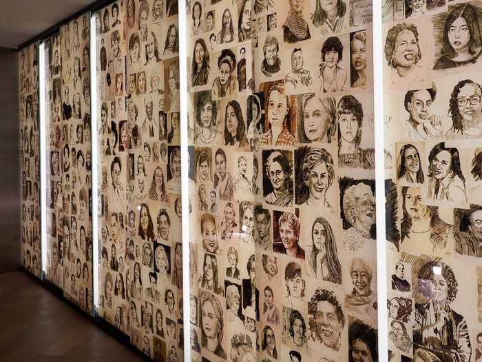 Nearby, a "Wall of Honor" illuminates sketches of 221 men and women who have led the fight for women