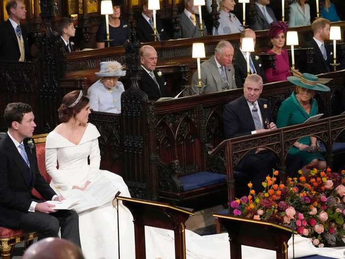 As the ceremony began, Eugenie shared this adorable moment with her parents, the Duke and Duchess of York, who couldn