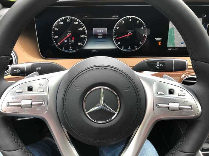 The Mercedes instrument cluster is an analog-digital affair, and the screen joins with the infotainment layout to dominate the dashboard.