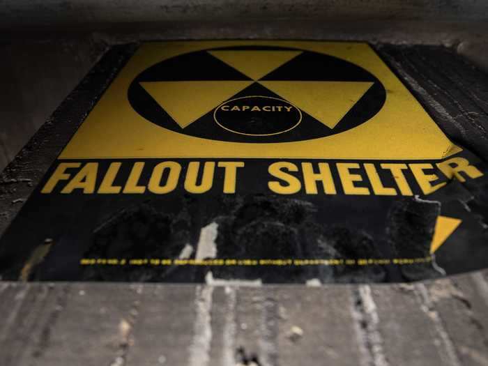 A sign in the basement still hangs on the wall, designating the area as a fallout shelter.