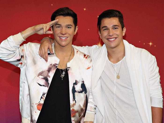 Pop singer Austin Mahone draped his arm around his wax figure.