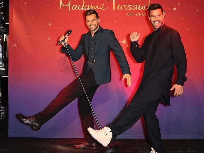 Singer Ricky Martin showed off next to his wax figure.