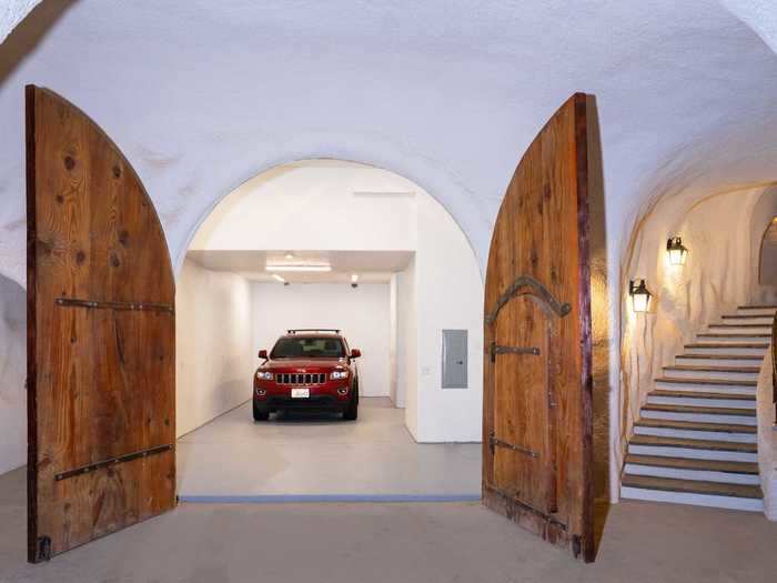 Up to six cars can park on the property, and an indoor garage includes two parking spots as well as a large gear storage room.