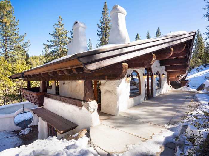 The home shares some characteristics with Alpine chalets in Bavaria, Germany, such as a gently sloping wooden roof and overhanging eaves.