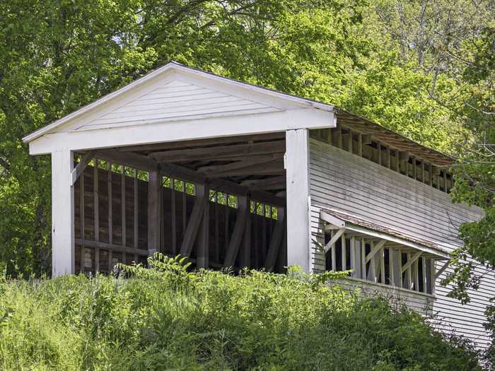 The Portland Mills Covered Bridge in Parke County, Indiana, was saved from demolition and is now the perfect backdrop for a picture.