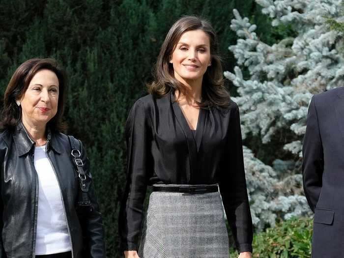 Queen Letizia turned heads in a grey plaid skirt with an asymmetrical hemline at an event in October 2019.
